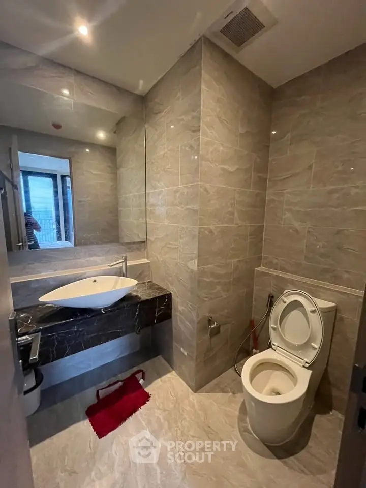 Modern bathroom with sleek fixtures and elegant marble tiles