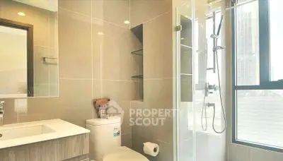 Modern bathroom with sleek design and large window for natural light.