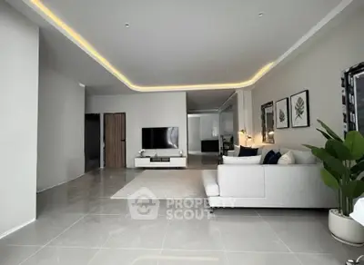 Spacious modern living room with elegant decor and sleek tile flooring