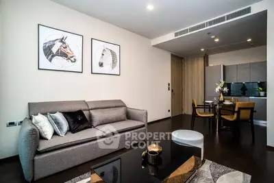 Modern living room with stylish decor and open kitchen layout in a contemporary apartment.