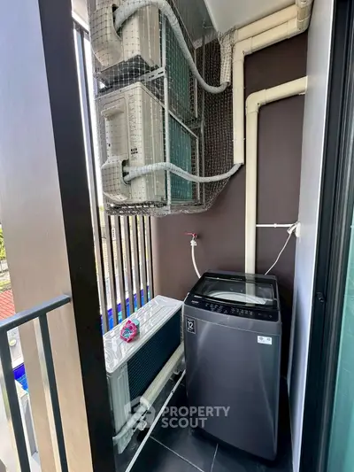Compact balcony with washing machine and air conditioning units