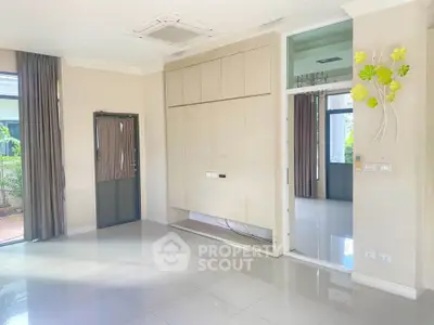 Spacious living room with modern design and large windows for natural light