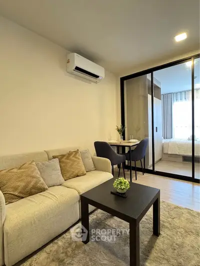 Modern living room with cozy sofa and dining area in stylish apartment