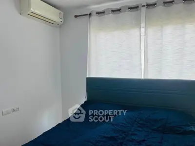 Cozy bedroom with air conditioning and modern decor