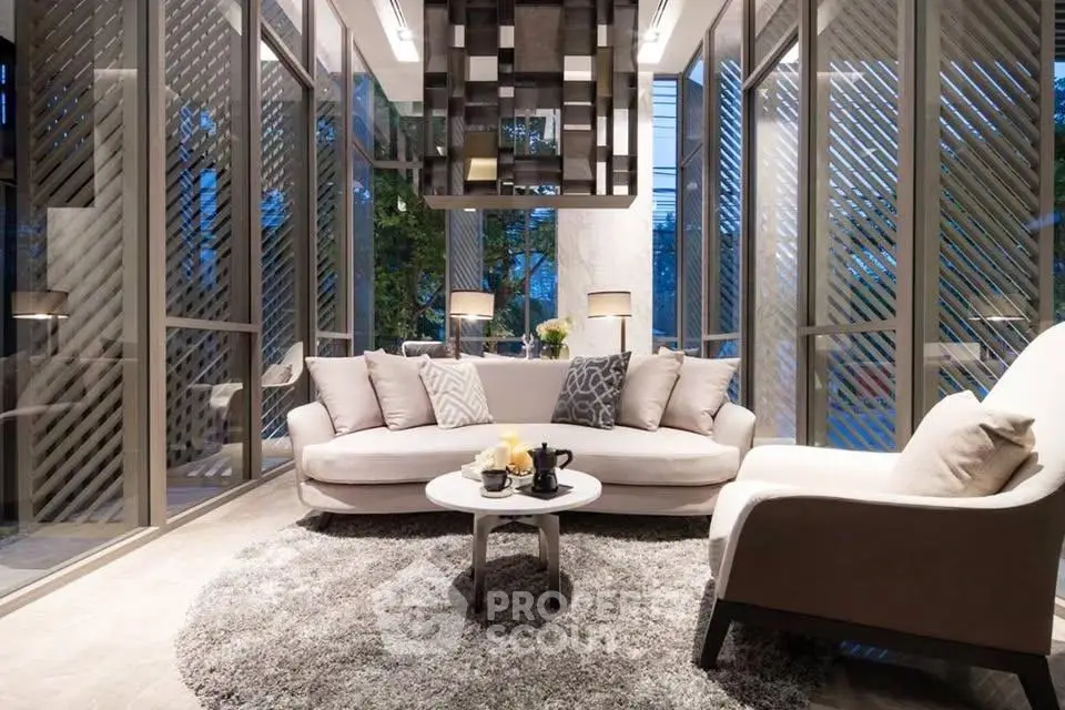 Luxurious modern living room with large windows and elegant decor