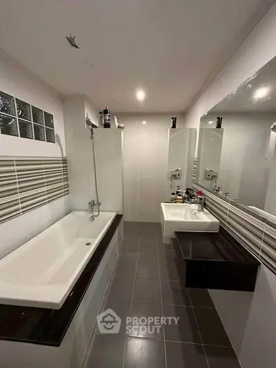 Modern bathroom with sleek design and spacious bathtub