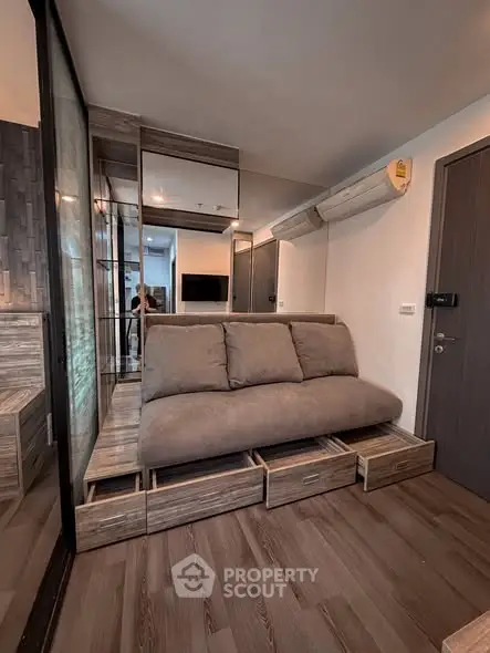 Modern living room with stylish sofa and built-in storage drawers