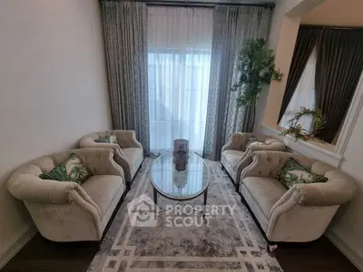 Elegant living room with plush sofas and stylish decor, perfect for relaxation and entertaining.