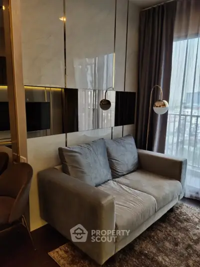 Luxurious modern living room with plush velvet sofa, elegant lighting, and sleek entertainment unit, set against a backdrop of floor-to-ceiling windows draped in sophisticated curtains.