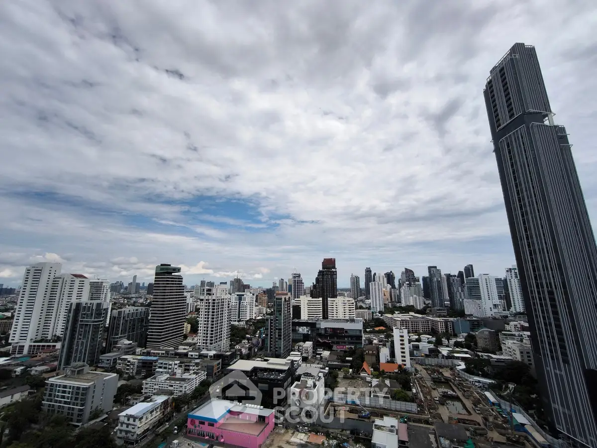 Stunning cityscape view showcasing modern skyscrapers under a dramatic cloudy sky.