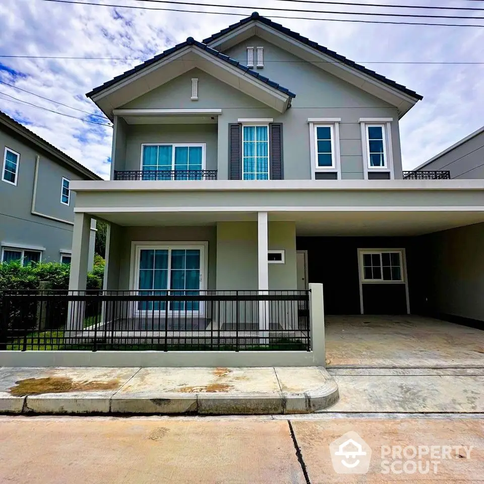 Modern two-story house with spacious driveway and elegant facade