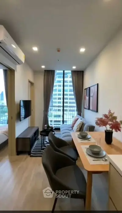 Modern living room with balcony view in high-rise apartment