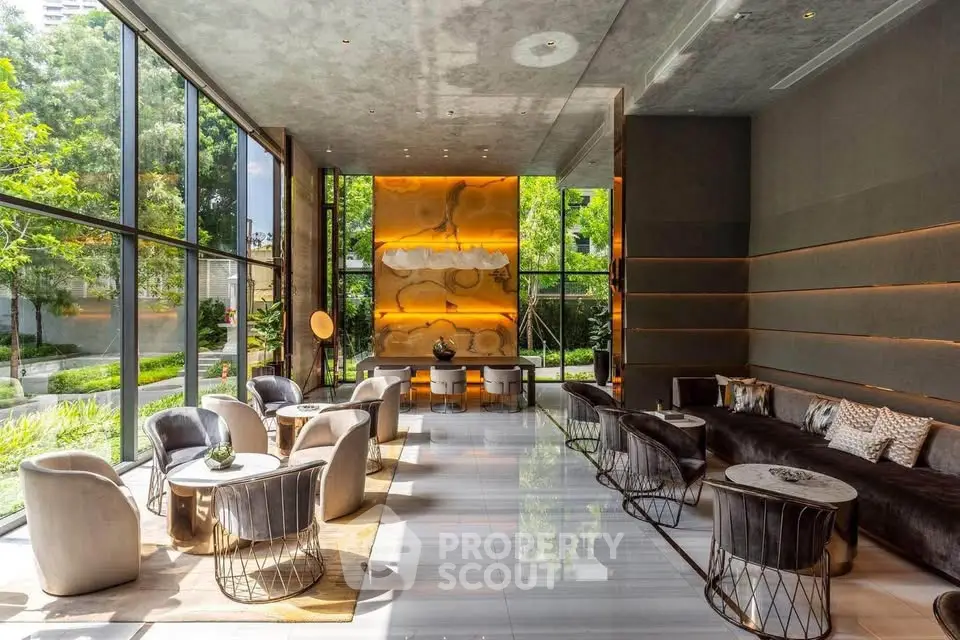 Luxurious modern lobby with floor-to-ceiling windows and elegant seating in a high-end building.