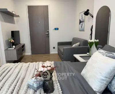 Cozy modern living room with stylish decor and comfortable seating, perfect for relaxation.