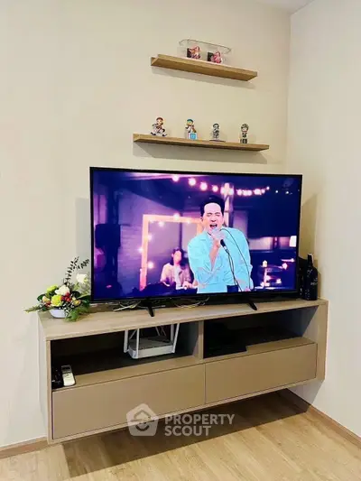 Modern living room with mounted TV and stylish shelving