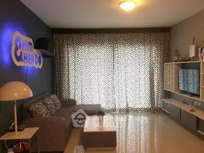 Modern living room with stylish decor and large window curtains