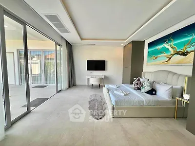 Luxurious modern bedroom with large windows and stylish decor