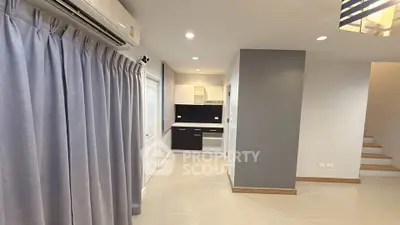 Modern interior with sleek kitchen and air conditioning, ideal for comfortable living.