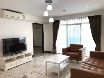 Spacious living room with modern furniture and natural light