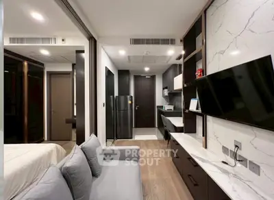 Modern apartment interior with sleek design, featuring a cozy living area, stylish kitchen, and elegant decor.