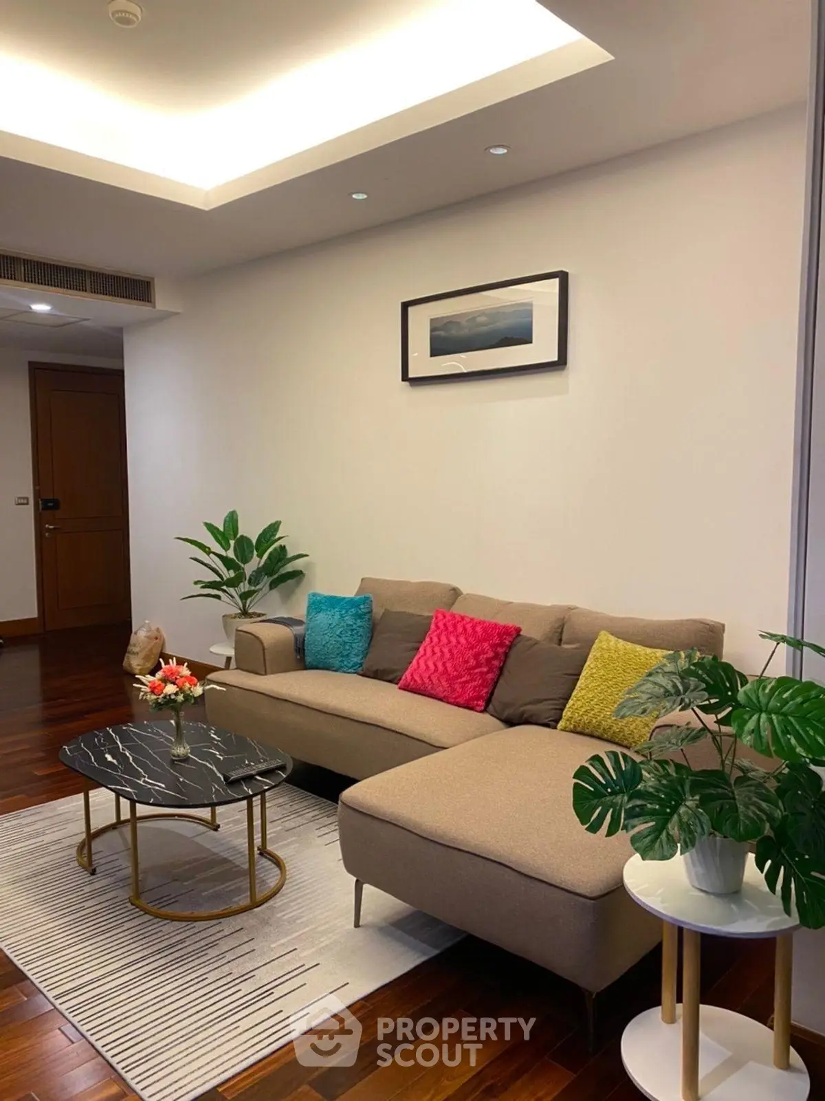 Stylish living room with modern sofa and chic decor in a cozy apartment.