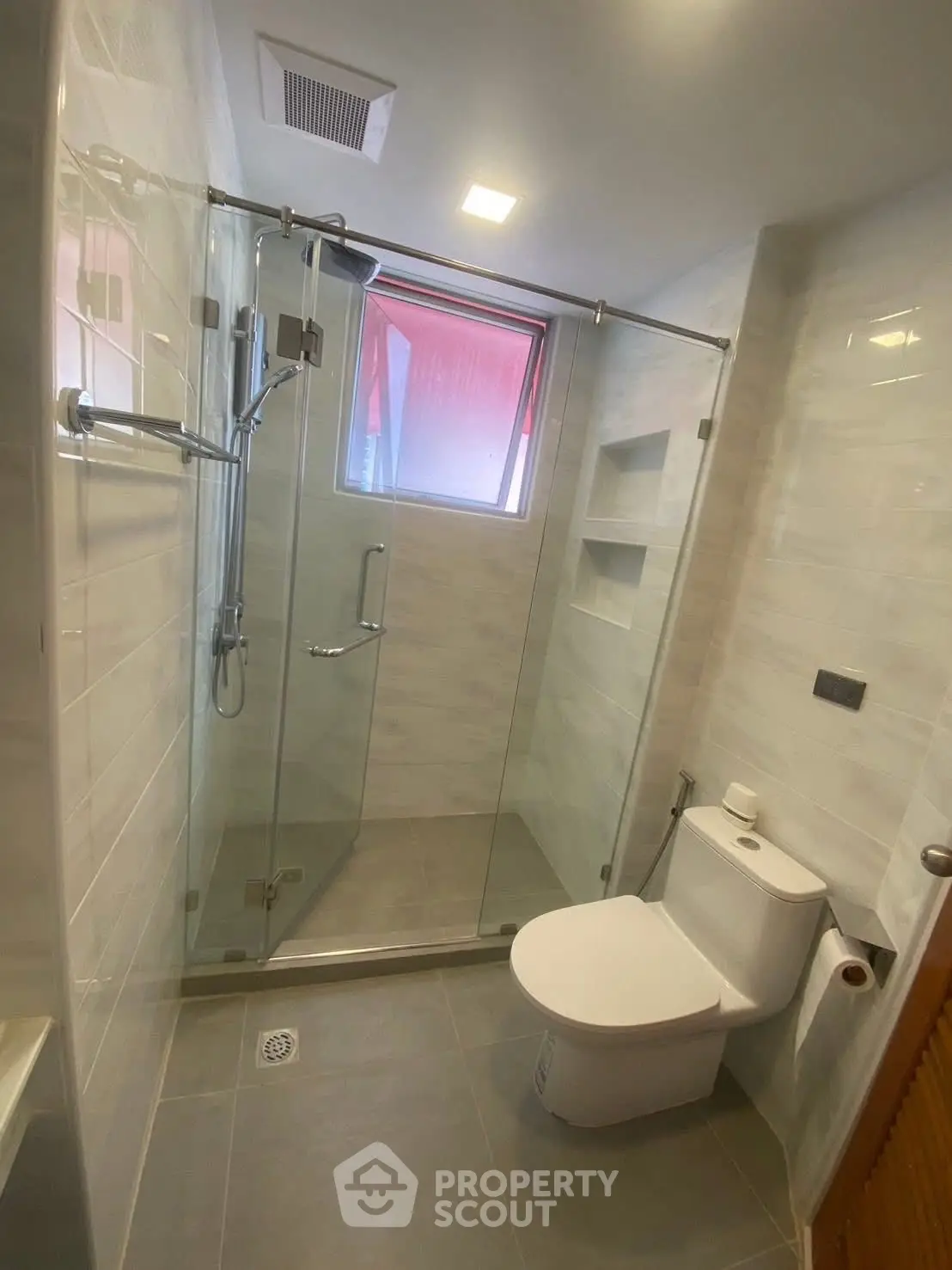 Modern bathroom with glass shower and sleek fixtures