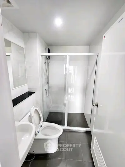 Modern bathroom with sleek shower enclosure and contemporary fixtures