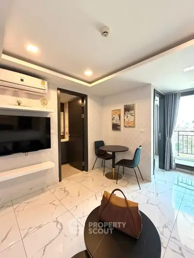 Modern living room with marble flooring and balcony view