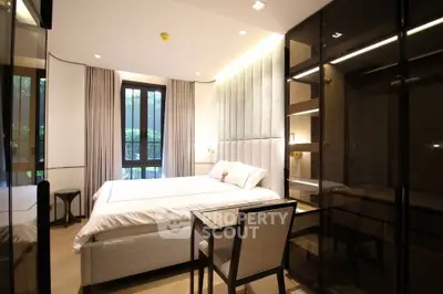 Luxurious bedroom with elegant decor and large windows in modern apartment