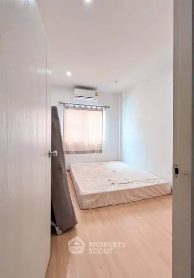 Cozy bedroom with minimalist decor and natural light