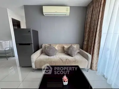 Modern living room with sleek sofa, air conditioning, and stylish decor