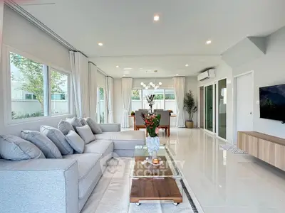 Spacious modern living room with elegant decor and large windows