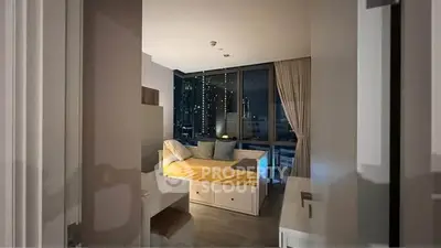 Cozy bedroom with city view, modern decor, and ample natural light.
