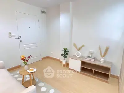 Modern minimalist living room with stylish decor and light wood flooring