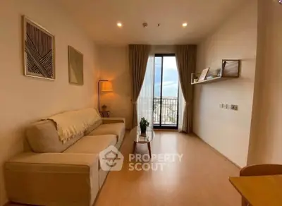 Cozy living room with modern decor and balcony view