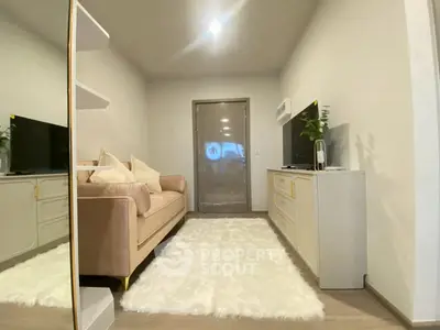 Cozy living room with modern decor and plush sofa in a stylish apartment.