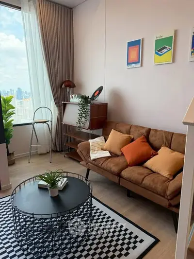 Stylish living room with city view, modern decor, and cozy seating area.