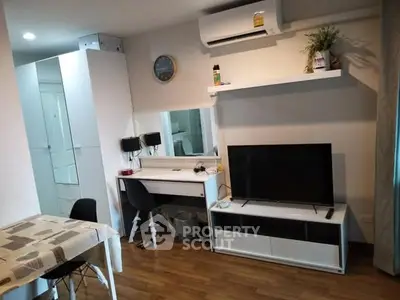 Modern living room with sleek furniture and air conditioning unit