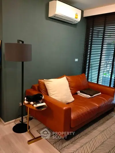 Stylish living room with leather sofa and modern decor