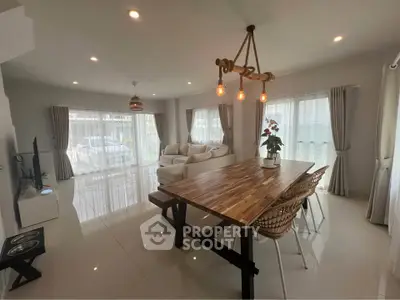 Spacious modern living room with elegant dining area and natural light