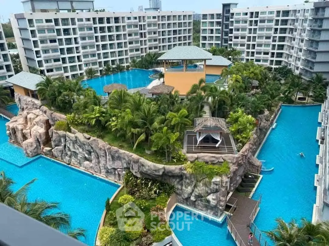 Luxurious condominium with stunning pool and lush landscaping in a modern residential complex.