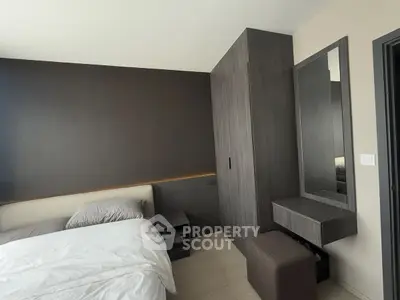 Modern bedroom with sleek dark wood furniture and minimalist design