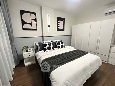 Modern bedroom with stylish decor and ample storage space