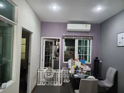 Cozy dining area with air conditioning and access to kitchen