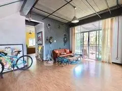 Spacious modern living room with large windows and stylish decor