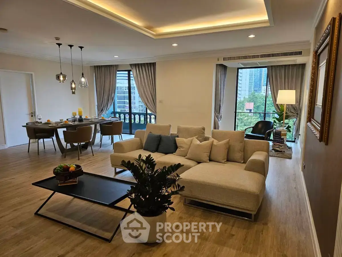 Spacious modern living room with elegant dining area and city view, perfect for urban living.