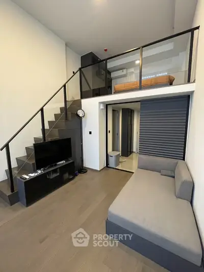 Modern loft apartment with mezzanine bedroom and sleek living area
