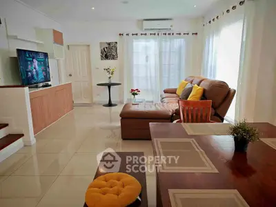 Spacious living room with modern decor and natural light