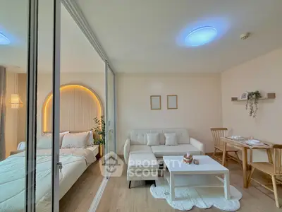 Modern studio apartment with cozy living area and stylish bedroom