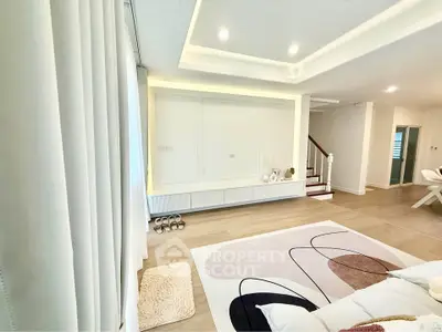 Spacious modern living room with elegant ceiling lights and stylish decor